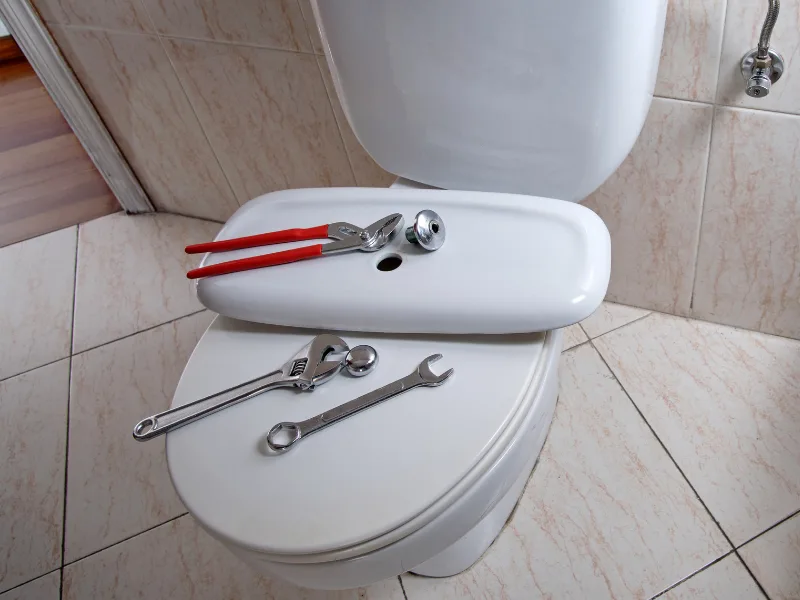 Image of installing a toilet.