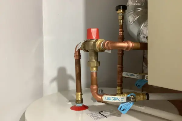 Closeup of pipes of water heater.
