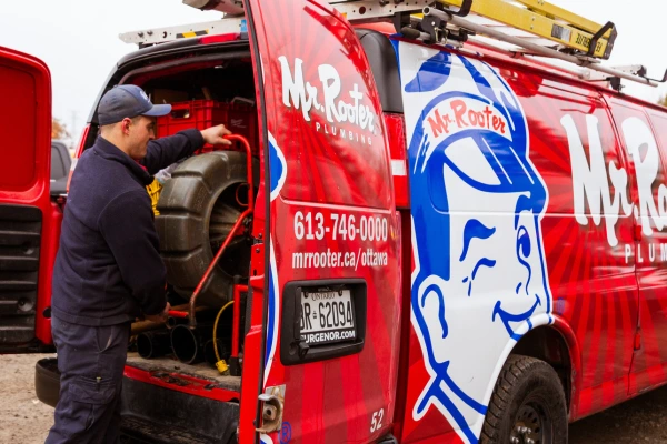 Agent taking tools from van.