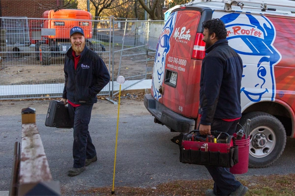 Mr. Rooter technician arriving at home with an apprentice.