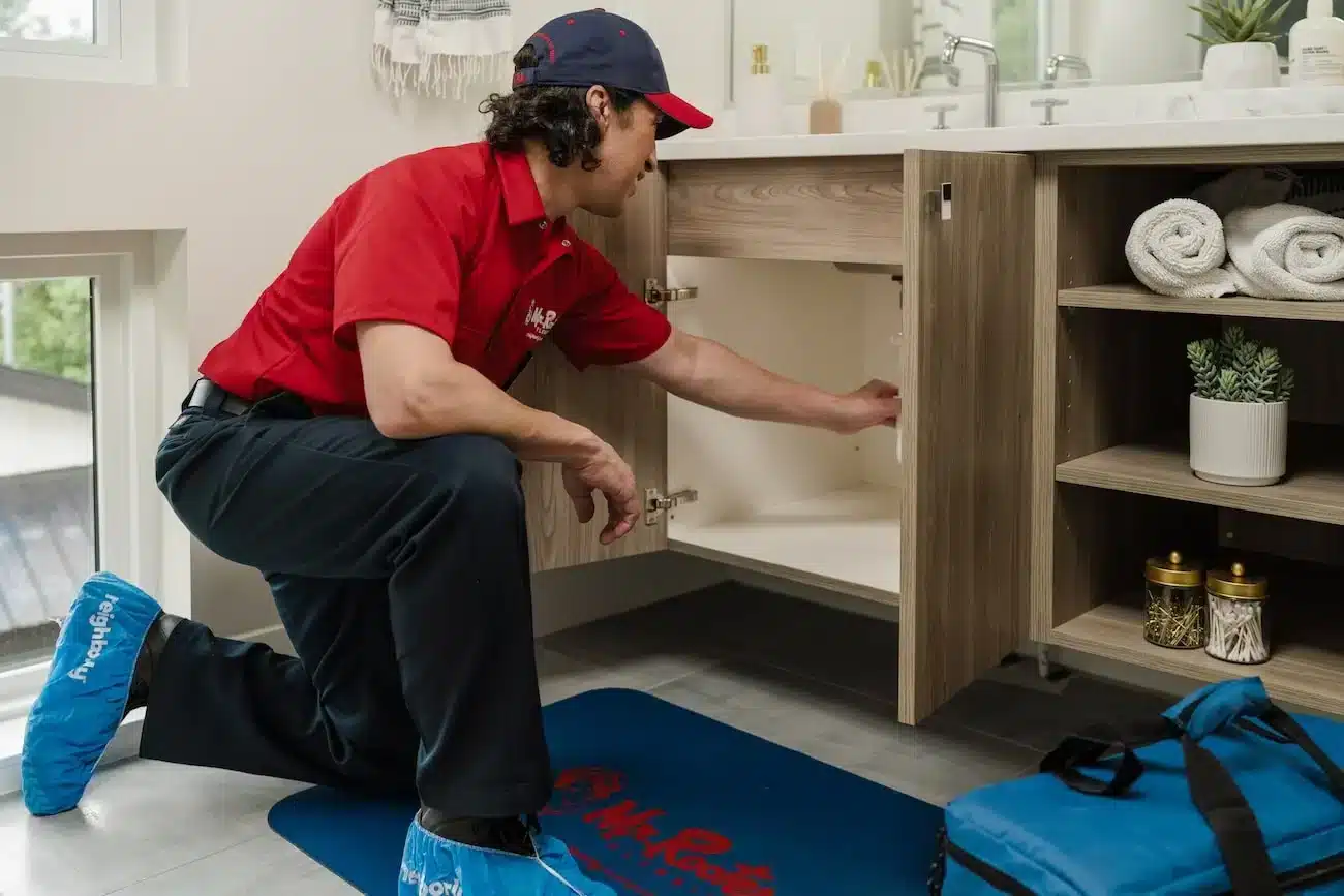 Mr. Rooter employee cleaning a drain in Tobiano, British Columbia